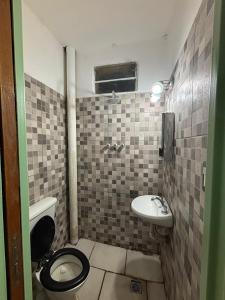 a bathroom with a toilet and a sink at Nido Urbano in San Luis