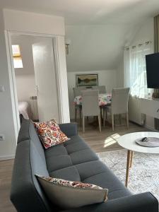 a living room with a couch and a table at SarajevoView in Ivišovo Greblje