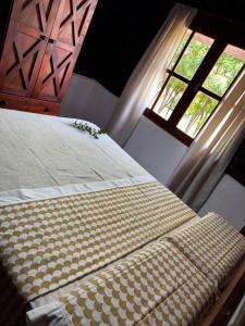 En eller flere senge i et værelse på Amanecerenunsueñoyacanto