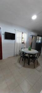 a dining room with a table and two chairs at La Casita de Oreste in Cosquín
