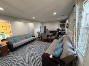 a living room with a couch and a table at JD Apartment and House in Seaside Heights
