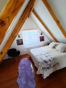 Giường trong phòng chung tại Cabañas Tricahue +21 ảnh