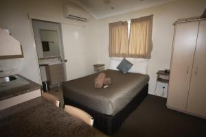 Postel nebo postele na pokoji v ubytování Injune Haven Motel