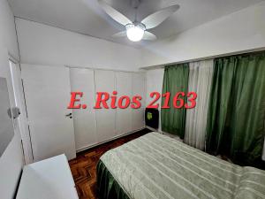 a bedroom with a bed and a ceiling fan at Dos ambientes plaza colon in Mar del Plata +6 photos