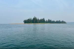 an island in the middle of a large body of water at Sandbox in Malvan