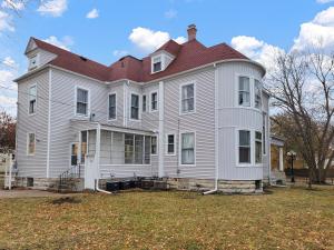 a large white house with a red roof at The Palace in Rockford