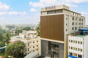 a building with a park sign on top of it at Park Inn & Suites by Radisson, Puri in Puri