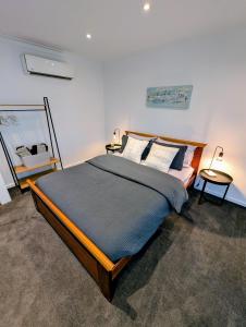 a bedroom with a large bed in a room at Entire Studio in Moonee Ponds with Free Parking in Melbourne