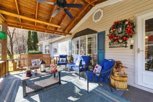 a porch with blue chairs and a christmas wreath at Twin Ponds Retreats retreat in Whittier +51 photos
