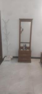 a mirror sitting on a dresser in a room at Negombo Villa in Negombo