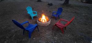 a group of chairs around a fire pit at Travis' Place - Convenient and Affordable Location in Rossville +27 photos