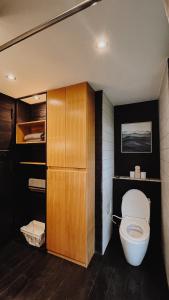 a bathroom with a toilet in a room at Wanagiri Cabin Wanara in Gitgit +29 photos