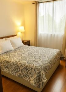 Postel nebo postele na pokoji v ubytování Condominio Espacio Uno Fco de Aguirre