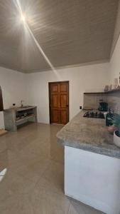 a kitchen with a counter and a stove top oven at KAIA VILLAGE, Santa Teresa, Costa Rica in Santa Teresa Beach +9 photos