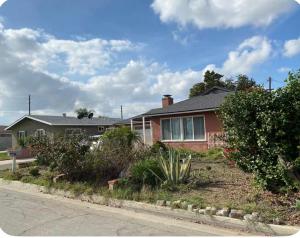 a house with a garden in front of it at Citrus Loft - Quiet and convenient female only in Covina