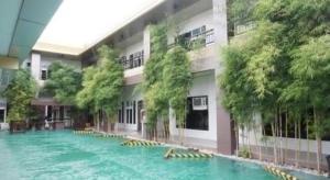 a large swimming pool in front of a building at Zanrock Micro Hotel in Lagao III