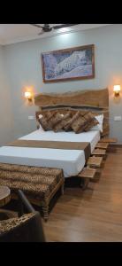 a bedroom with two beds with pillows on them at Centre point jawai in Bīsalpur +24 photos
