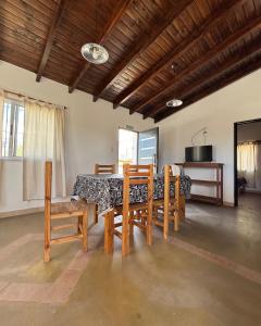 a dining room with a table and chairs at Cabañas Pukara in Cafayate