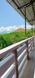 a white bench sitting on top of a building at Villareal Homestay in Coron