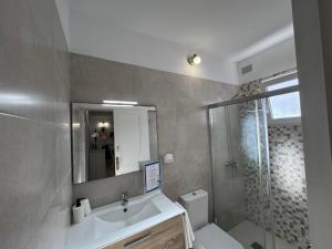 a bathroom with a sink and a toilet and a shower at Vidamar in Abades +41 photos