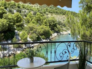 a view of a river from a balcony at Private Hideaway in ut Island in Otočić Svršata Mala