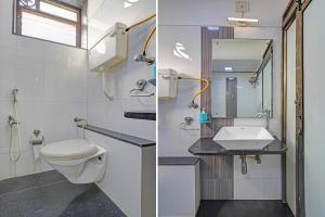 a bathroom with a toilet and a sink at Collection O Dandiya Bazar Formerly Vrundavan Residency in Vadodara +24 photos