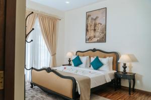 เตียงในห้องที่ Grand Misty Hills +49 ภาพ