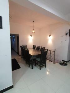 a dining room with a table and chairs at Mystik Muthu View Haputale in Haputale +26 photos