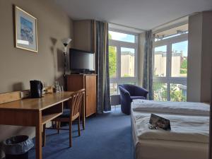 En eller flere senge i et værelse på Hotel Rheinpark Rees + 36 billeder