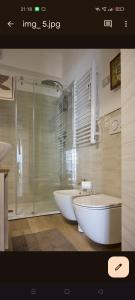 a bathroom with two sinks and a tub and a shower at 50 passi dal mare in Sestri Levante