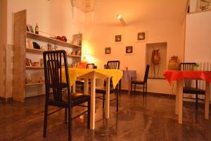 a dining room with a table and chairs at Ciao Bello B&B in Martina Franca