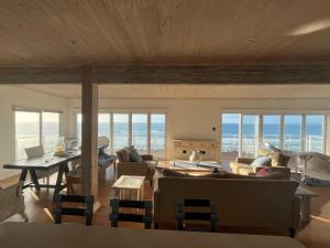 a living room with a view of the ocean at 8 Muller st Tergniet in Tergniet