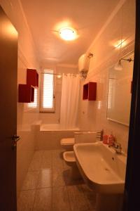 a white bathroom with two toilets and a sink at Ciao Bello B&B in Martina Franca +41 photos