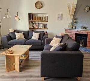 a living room with a couch and a coffee table at Casa dos amigos in Chão de Couce