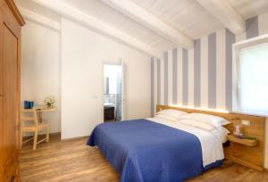 Postel nebo postele na pokoji v ubytování Bellafiora Affittacamere + 21 fotografií
