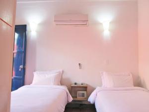 Postel nebo postele na pokoji v ubytování Zana Hotel Boutique