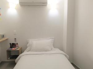 Postel nebo postele na pokoji v ubytování Zana Hotel Boutique