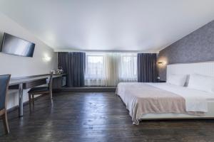 Кровать или кровати в номере Apart Hotel Kvartira 1