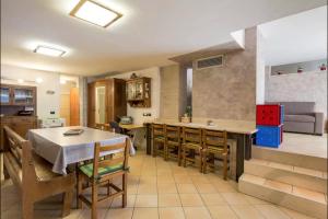 a kitchen and dining room with a table and chairs at Open Space Verona in Verona