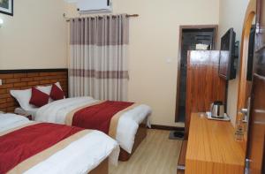 Letto o letti in una camera di Hotel Bagmati