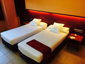 Postel nebo postele na pokoji v ubytování Hotel Jonquera