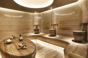 a sauna with two toilets and a round wooden table at Berjer Boutique Hotel & Spa in Istanbul