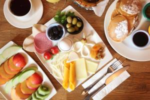a table topped with plates of food and fruit at Berjer Boutique Hotel & Spa in Istanbul