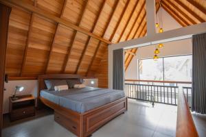 a bedroom with a bed with a wooden ceiling at Gone4Coastal - Cabana in Hikkaduwa +33 photos