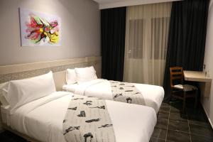 A bed or beds in a room at Hotel A44