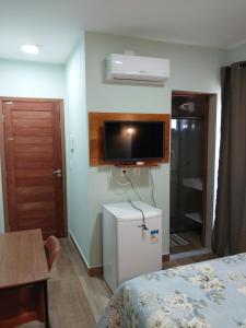 Et tv og/eller underholdning på Pousada Tia Rosa