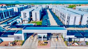 an aerial view of a city with white buildings at Cozy Habitat in Gaborone