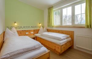 A bed or beds in a room at Ferienwohnungen Schwabhof
