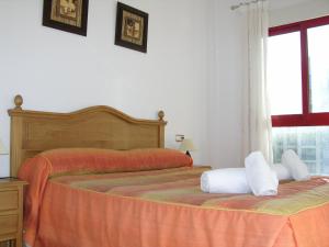 A bed or beds in a room at Verdemar 8907 - Resort Choice Még 35 kép