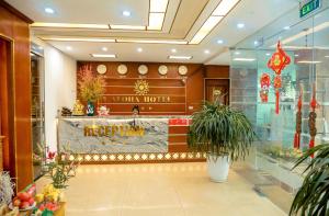 a lobby of a hotel with a sign that says navajo hotel at khách sạn Aloha in Hanoi